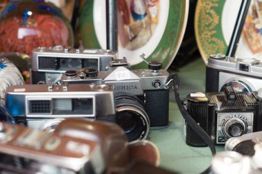 Old collector's cameras at a flea market. Second hand analogue cameras.