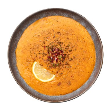 Ezogelin Soup in gray bowl isolated on white. Turkish cuisine traditional dish with red lentils, bulgur and rice.