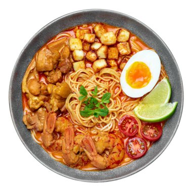 Laksa in gray bowl isolated on white. Coconut noodle soup with chicken meat and prawns of peranakan cuisine. Asian food.