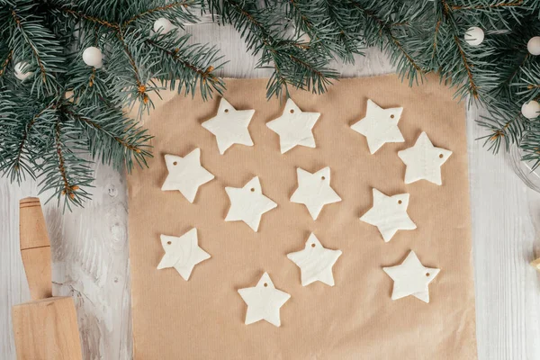 Step-by-step Christmas stars homemade cold porcelain garland tutorial. Step 16: Place decorations on dry surface and leave to dry for 8-12 hours depending on thickness. Top view