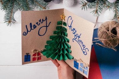 Step-by-step Greeting card 3D Christmas tree tutorial. Step 21: Write something, optionally. Greeting card is ready. Top view clipart