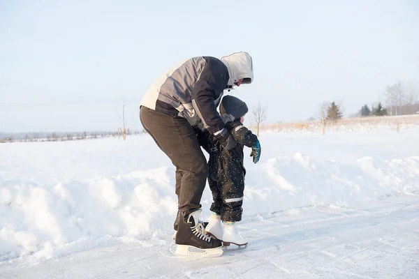 Grandfather Teaching Her Little Grandson Ice Skating Outdoor Skating Rink Stock Picture