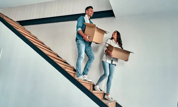 Moving New Home Happy Young Couple Holding Cardboard Boxes While — Stock Photo, Image