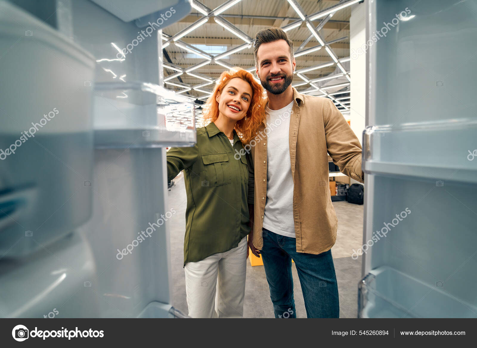 https://st.depositphotos.com/38378404/54526/i/1600/depositphotos_545260894-stock-photo-young-couple-choosing-refrigerator-home.jpg