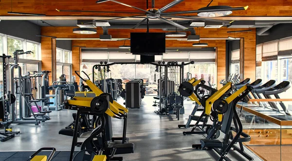 Within gym with modern fitness equipment for fitness events and more. Modern of gym interior with equipment. Sports equipment in the gym.