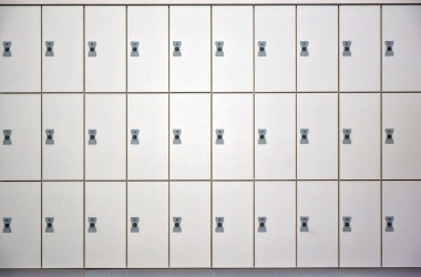 three rows of white closed wardrobe boxes with locks