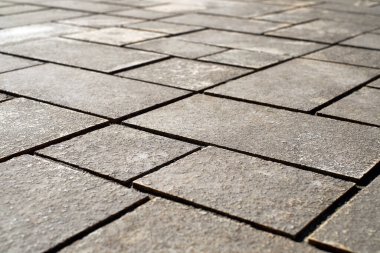 Taş kaldırım dokusu. Granit kaldırım taşları arka planı. Eski kaldırım kaldırımının soyut arkaplanı. Kusursuz doku.