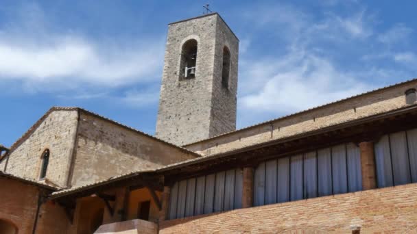 Bell tower of a very austere Romanesque style brick church — Stock Video