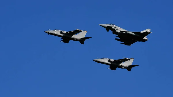 AMX Ghibli and Eurofighter Typhoon combat military fighter jets formation — Stock Fotó