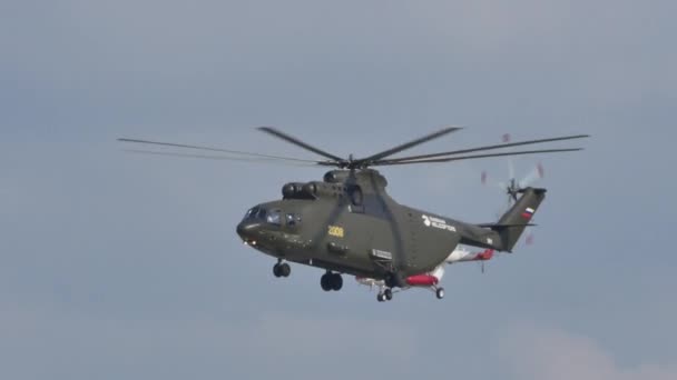 Huge Russian helicopter flying in formation with another rescue helicopter — Stock Video