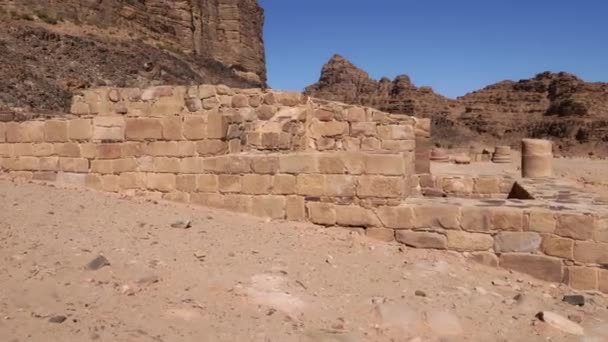 Ruins of an ancient Nabataean building built of red granite blocks — Stock Video