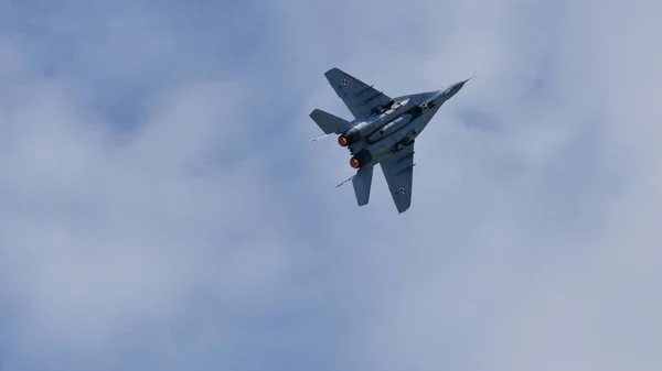 Top view of a NATO air defense airplane in the blue sky. Copy space — Stock Photo, Image