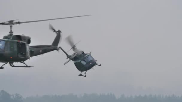 Vietnam war era military helicopters in flight — Stock Video
