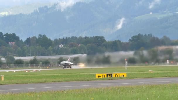 Scenic vintage fighter jet airplane take off from wet runway in 4K — Video