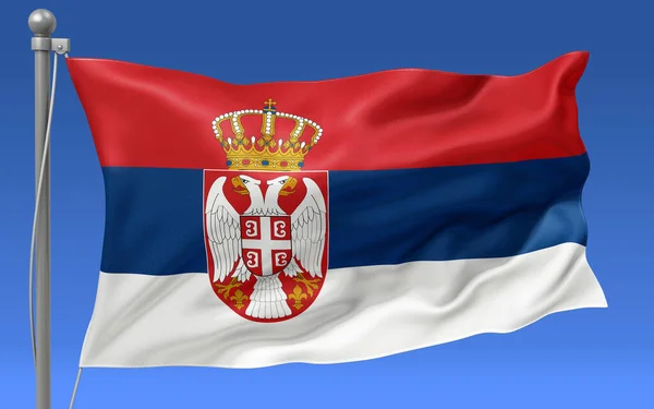 塞尔维亚的国旗飘扬在旗杆顶上 蓝天作为背景 — 图库照片