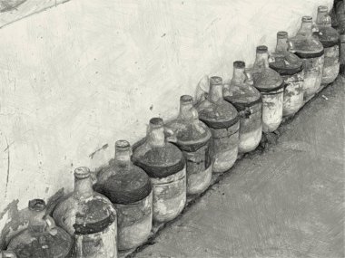 black and white of bottle on the ground