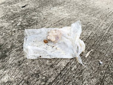 Dirty plastic on cement floor