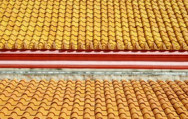 tiles roof on public temple at Thailand