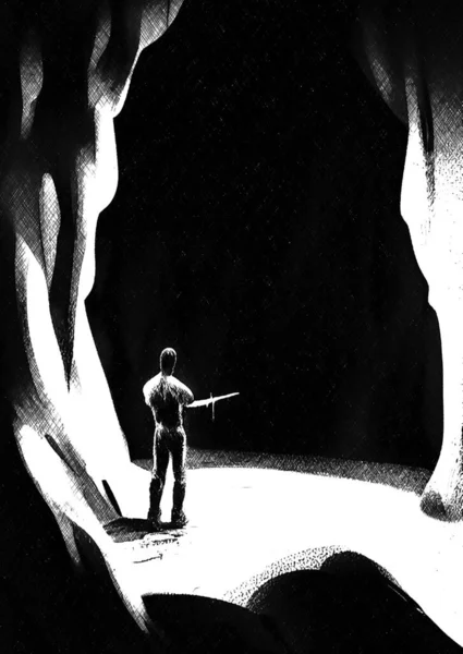 black and white of man in the cave