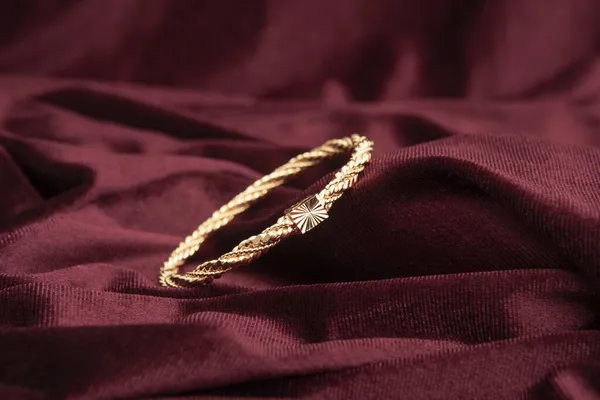 Gold Bracelet Burgundy Velvet Fabric — Stock Photo, Image