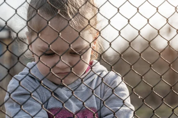 Little Girl Sad Look Metal Fence Social Problem Refugees Forced — Foto Stock