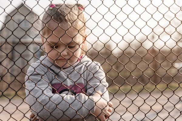 Little Girl Sad Look Metal Fence Social Problem Refugees Forced — Stock Fotó