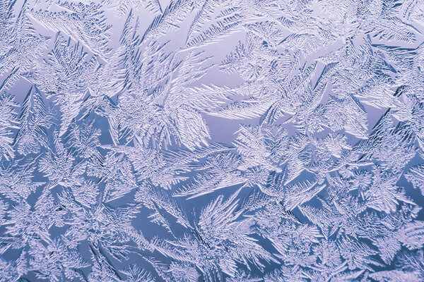 Abstract frosty pattern on glass, background texture.