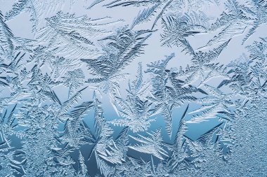 Cam, arkaplan dokusu üzerindeki soyut buz deseni.