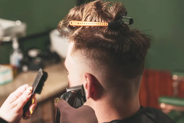 Girl Hairdresser Makes Haircut Young Guy Using Hair Clipper Barbershop — Stock Photo, Image