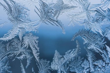 Cam, arkaplan dokusu üzerindeki soyut buz deseni.