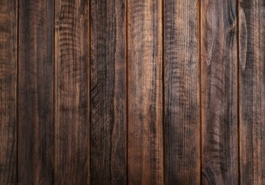 Kahverengi kırsal koyu ahşap doku. Tablo dikey çizgilerinin üst görünüm yüzeyi