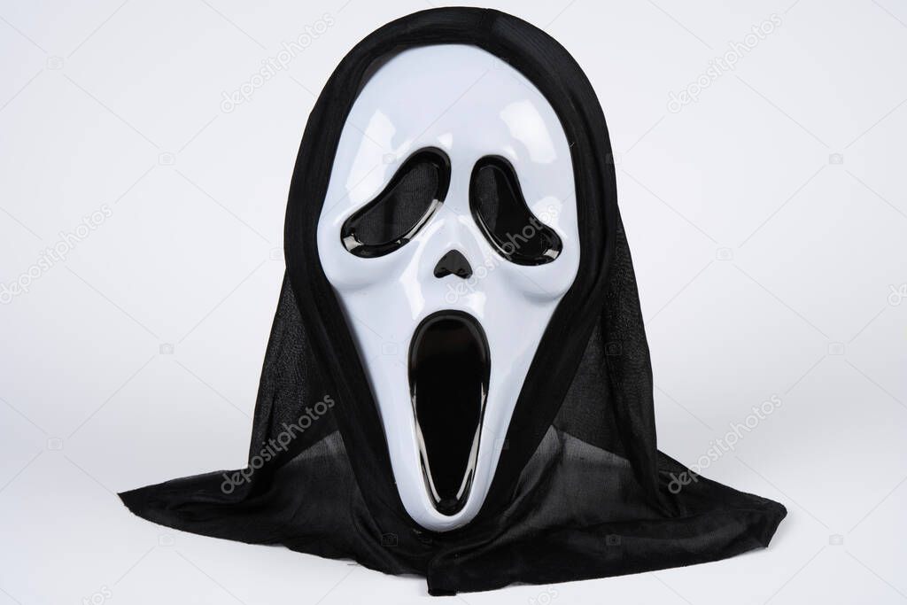 Paris, France - 11 22 2021: Packshot of Masked woman. A black and white scream mask