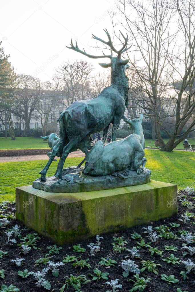 Paris, France - 01 15 2022: The Luxembourg Garden. View of Statue of deer herd inside the park