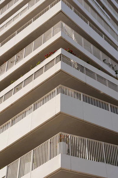 Eco-neighborhood. Detail of a white design building with balconies