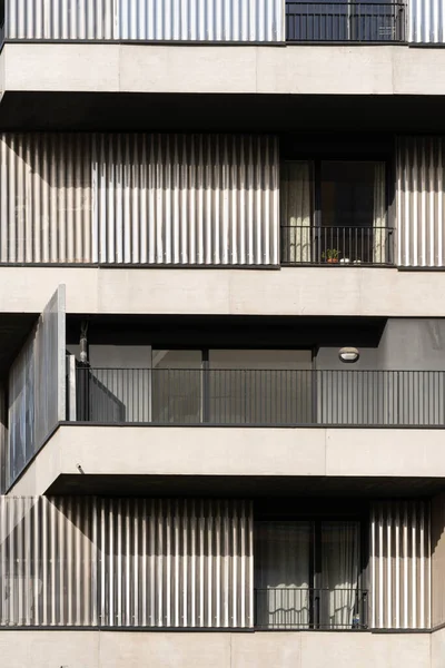 Eco-neighborhood. Detail of a white design building with balconies