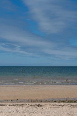 View of  a cloudy sky above the sea from the beach