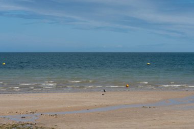 View of  a cloudy sky above the sea from the beach