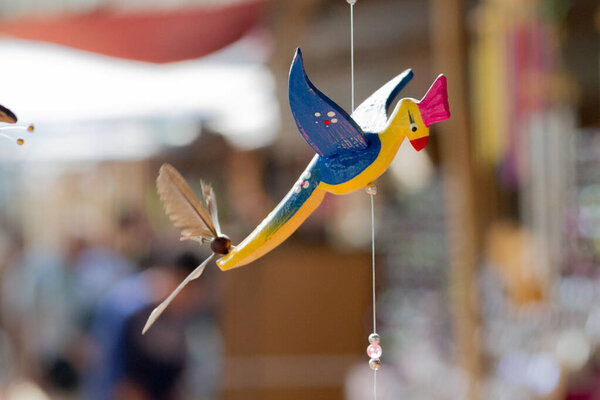 Close-Up Of Hand Carved Bird Wooden Mobile.