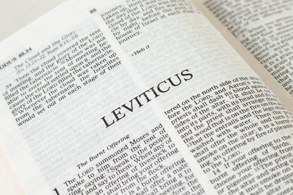 Leviticus open Holy Bible Book close-up. Old Testament Scripture. Studying the Word of God Jesus Christ. Christian biblical concept of faith, trust, and hope.