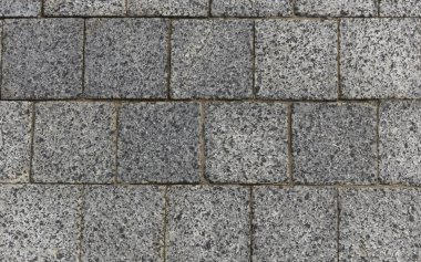 Gray granite pavement. Pavement texture background.