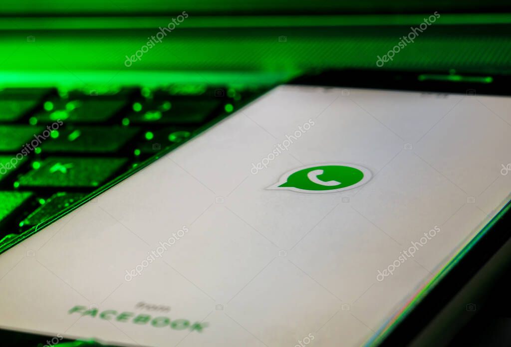 Cagliari, Sardinia, Italy - 30 10 2021 - Mobile phone smartphone on a computer keyboard with the Whatsapp app logo on starting screen