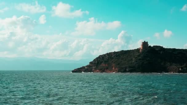 Lighthouse above it overlooking the mediterranean sea — Stock Video