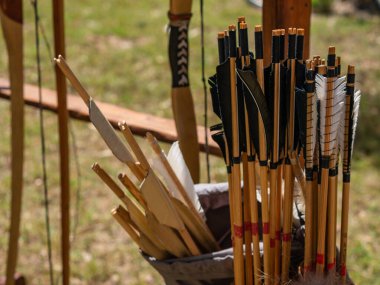 medieval reenactment - close-up shot medieval bow arrow feathers