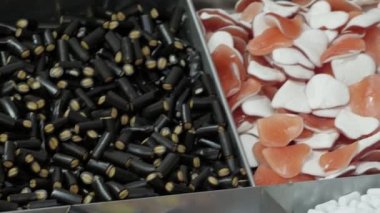 confectionery market, sale of various types of sweets and licorice. Colorful and sweet gummy candies