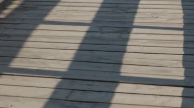 walk wooden bridge, wooden floor over a lake in a park