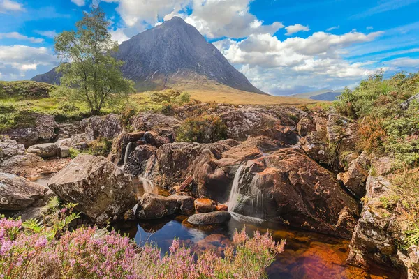 Coupall Falls and Buachaille Etive Mor in Scotland with beautiful light on the mountain. — Stock Photo, Image