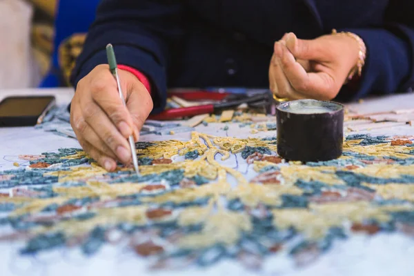 Artist, Mosaic Tools, Hand Craft, Uses Tweezers To Make Mosaic, Close Up. Ancient process of making mosaics. Madaba, Jordan. Jordan - Dec 2020: