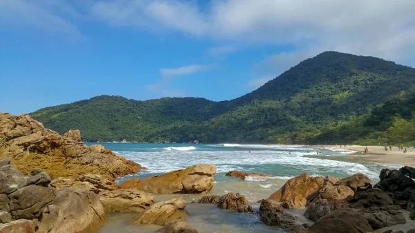 Woman looking at Cachadao beach in Paraty, Rio de Janeiro.