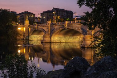 Beautiful night view of the bridge over the river Po in the city of Turin, Italy.
