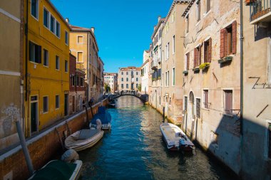 VENICE, ITALY - August 27, 2021: View of empty water streets with a few tourists on the canals of Venice